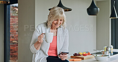 Buy stock photo Woman, drinking coffee and smartphone or senior in kitchen, funny online conversation and social media. Happy mature person, cellphone and internet connection or mobile app for communication at home