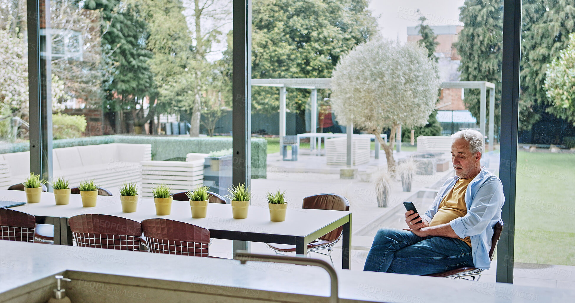 Buy stock photo Phone, search and senior man in a house with social media, streaming for subscription service. Smartphone, app or old male person enjoy retirement peace with online reading, chat or web communication