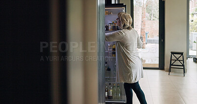 Buy stock photo Fridge, kitchen and senior woman in home searching for food for lunch, dinner and meal. Retirement, house and mature person by refrigerator for meal preparation for wellness, nutrition and health