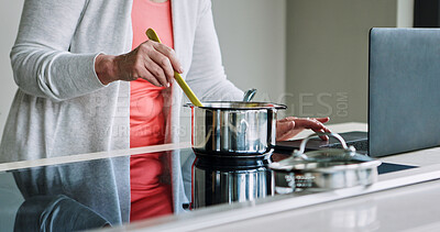 Buy stock photo Woman, hands and cooking on stove with laptop, recipe and reading a blog about food. Kitchen, pot or person mixing with wood spoon, scroll online or learning to prepare meal or dinner with nutrition