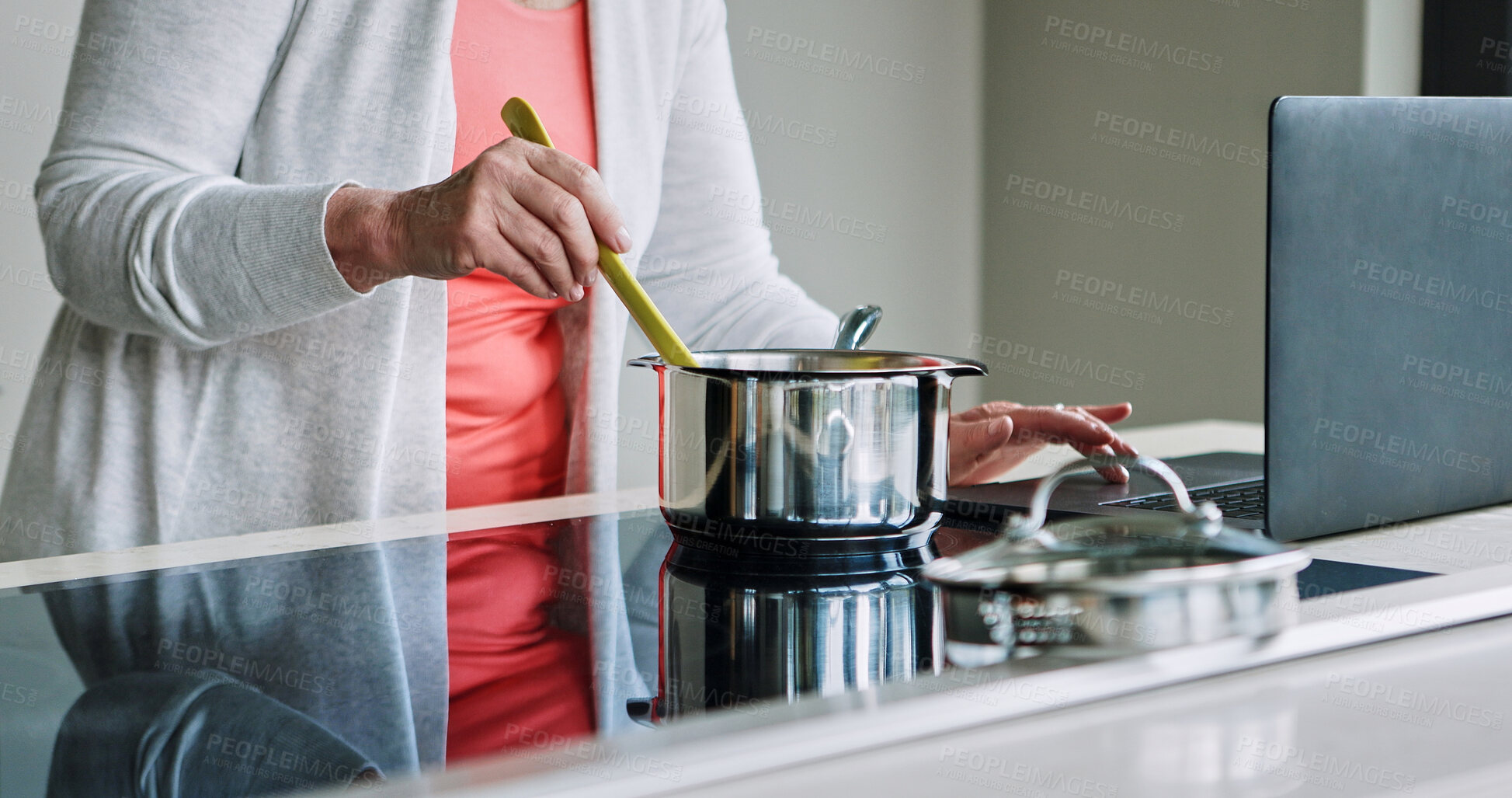 Buy stock photo Woman, hands and cooking on stove with laptop, recipe and reading a blog about food. Kitchen, pot or person mixing with wood spoon, scroll online or learning to prepare meal or dinner with nutrition