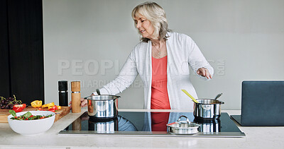 Buy stock photo Laptop, cooking and senior woman in the kitchen of modern home for healthy or diet supper. Food, technology and elderly female person preparing a meal for dinner or lunch with computer at house.