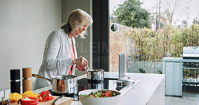 Buy stock photo Cooking, healthy food and mature woman in kitchen with laptop, recipe or reading a blog for dinner. Vegetarian, diet and person in home prepare vegetables, salad and nutrition in lunch or meal