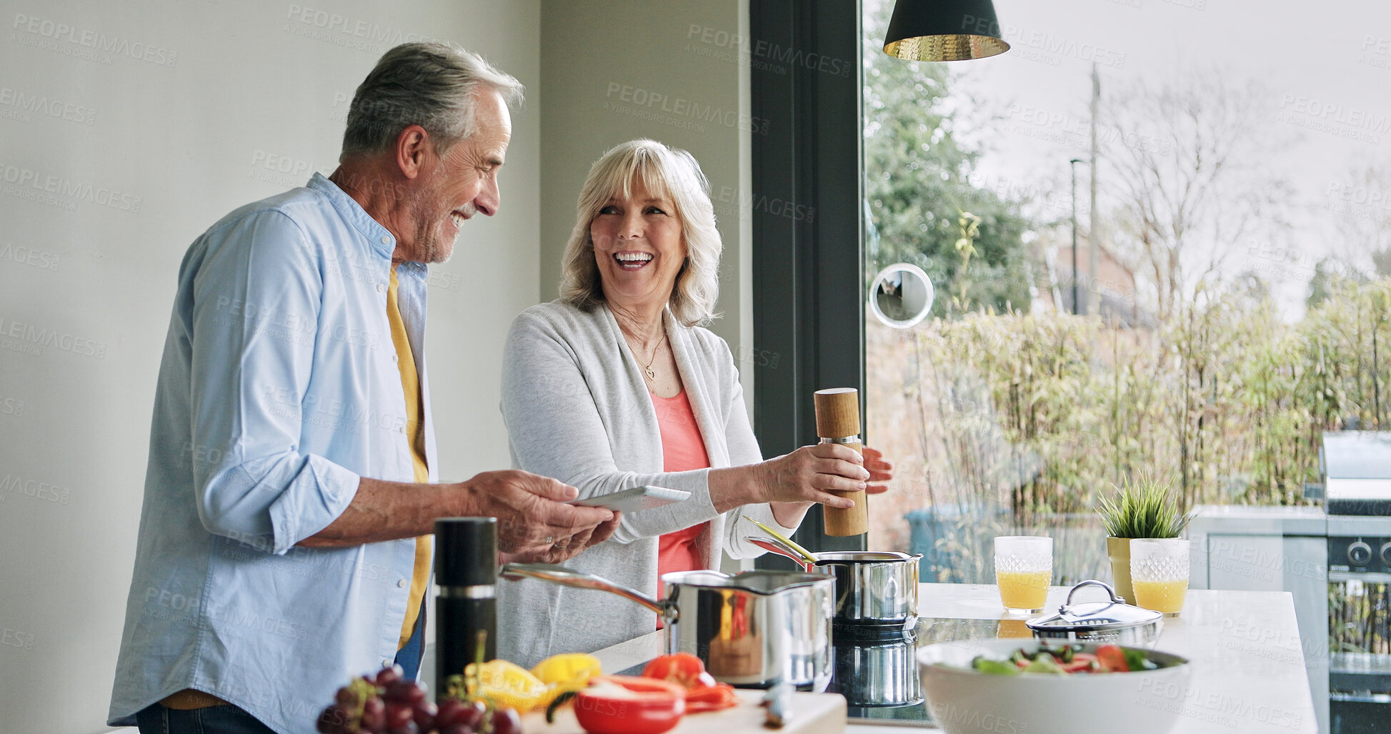 Buy stock photo Elderly, couple and cooking in kitchen with tablet for meal prep, recipe idea and digital menu and happy. Senior, man and woman with technology at home for healthy food ingredients and diet planning