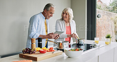 Buy stock photo Senior, couple and cooking in kitchen with tablet for meal prep, recipe idea and digital menu with smile. Elderly, man and woman with technology at home for healthy food ingredients and diet planning