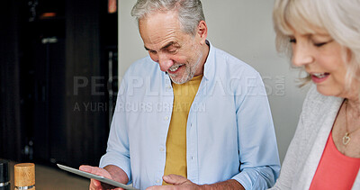 Buy stock photo Tablet, retirement and a senior couple in a home together for social media, streaming or browsing. Love, smile or happy with an elderly man and woman in their apartment for an online crossword