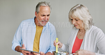 Buy stock photo Elderly, couple and cooking in kitchen with tablet for meal prep, recipe idea and digital menu with support. Senior, man or woman with technology at home for healthy food ingredients or diet planning