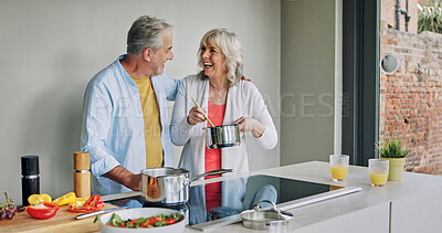 Buy stock photo Mature, couple and cooking in home with support, love and meal prep with healthy food in kitchen. Happy, man and woman embrace together at stove with vegetables, diet or nutrition in dinner or lunch