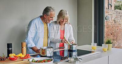 Buy stock photo Mature, couple and cooking in home with support, love and meal prep with healthy food in kitchen. Happy, man and woman embrace together at stove with vegetables, diet or nutrition in dinner or lunch