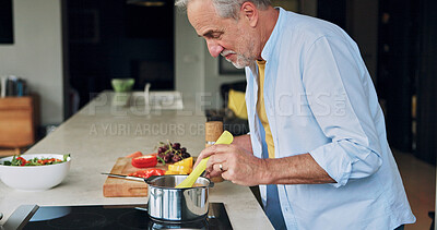 Buy stock photo Cooking, kitchen and senior man with food for lunch, supper and prepare healthy dinner in home. Retirement, chef skills and mature person with natural ingredients, cutting vegetables and organic meal
