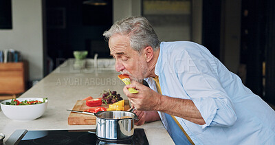 Buy stock photo Eating, cooking and senior man in the kitchen of modern home for healthy or diet supper. Food, chef and elderly male person in retirement prepare and taste nutrition meal for dinner or lunch at house