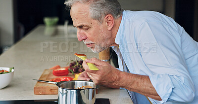 Buy stock photo Cooking, kitchen and senior man taste food for lunch, supper and prepare healthy dinner in home. Retirement, wellness and mature person with natural ingredients, cutting vegetables and organic meal