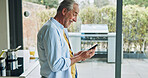 Senior man in kitchen with smile, phone and morning breakfast with social media meme in house. Home, online recipe and elderly person with smartphone, networking and reading happy email on mobile app