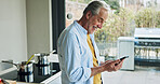 Senior man in kitchen with smile, smartphone and breakfast with social media meme in house. Home, online communication and elderly person with phone, networking and reading happy email on mobile app