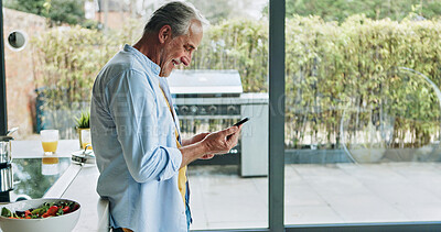 Buy stock photo Senior man in kitchen with smile, phone and breakfast with social media meme in house. Home, online communication and elderly person with smartphone, networking and reading happy email on mobile app