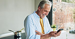 Elderly man in kitchen with smile, phone and meme on social media with laughing in house. Home, online communication and senior person with smartphone, networking or reading happy email on mobile app