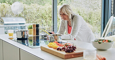 Buy stock photo Senior woman in kitchen with phone, cooking and breakfast with social media search in house. Home, online communication and elderly person with smartphone, networking and happy email on mobile app.