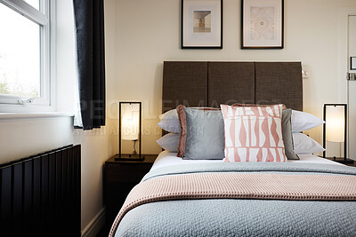 Buy stock photo Bed, empty room and accommodation at hotel for vacation for journey, adventure or tourism. Furniture, interior design and weekend or holiday in London or lodge for apartment, home decor or comfort