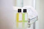 Hotel, hygiene and bottle of soap in bathroom at luxury accommodation for travel, vacation or holiday. Hospitality, health and closeup of liquid products in washroom at classy lodge for weekend trip.