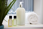 Hotel, lotion and bottle of soap in bathroom at luxury accommodation for travel, vacation or holiday. Hospitality, health and closeup of liquid products in washroom at classy lodge for weekend trip.