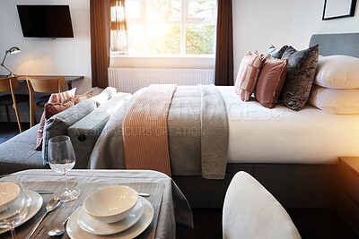 Buy stock photo Bed, empty room and hotel accommodation or service dinner meal with interior design, holiday or home decor. Furniture, plates and lodge resort in London or property linen, apartment or residential