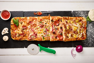 Top view, fast food and gourmet of pizza with ingredients for dinner preparation, baking process and meat. Patisserie, napoli sauce and onion with mushroom in restaurant or cafe for lunch from above