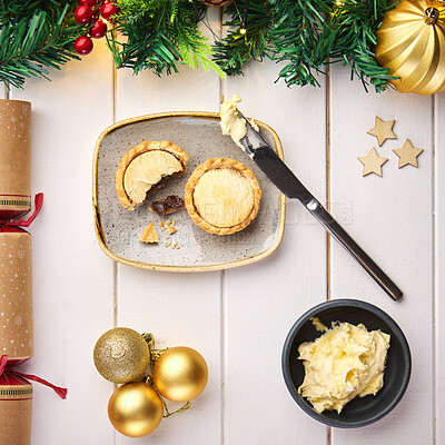 Buy stock photo Christmas, pie and decoration on table, above and holiday with food for lunch, celebration or festive in home. Meal, diet and nutrition with knife, butter and cracker for tradition, culture and party
