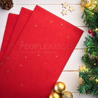 Buy stock photo Christmas, wrapping paper and decorations on table for gift, present or offering at holiday celebration. Ornament, holly and trinket with fancy covering for surprise, handout or donation from above