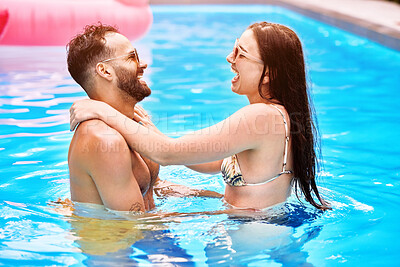 Buy stock photo Laugh, swimming pool and happy couple on vacation, holiday or travel outdoor together. Swimmer, funny man and woman in water to relax on summer date for love, embrace and romance at resort in Naples