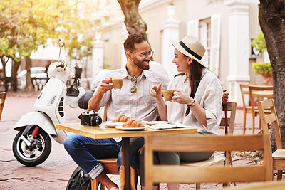 Buy stock photo Happy couple, relax and conversation with coffee at cafe for travel, love or outdoor bonding together. Young man, woman or tourists enjoying romantic getaway, beverage or holiday trip at restaurant