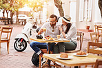 Couple, happy and eating in outdoor cafe with support, romantic time and breakfast together for health. Smile, man and woman with food in coffee shop for diet nutrition, bonding and honeymoon in Rome