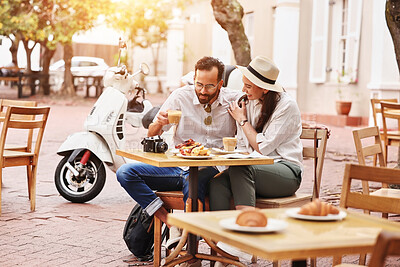 Buy stock photo Couple, happy and eating in outdoor cafe with support, romantic time and breakfast together for health. Smile, man and woman with food in coffee shop for diet nutrition, bonding and honeymoon in Rome