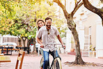Couple, bicycle and ride together in city for love bonding, fun holiday and sustainable travel. Happy man, woman and eco friendly transport in urban park for care, vacation and honeymoon in Italy