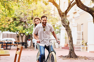 Buy stock photo Couple, bicycle and ride together in city for love bonding, fun holiday and sustainable travel. Happy man, woman and eco friendly transport in urban park for care, vacation and honeymoon in Italy