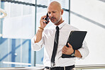 Phone call, man and listening in office for business, report and news or discussion. Professional person, lawyer and documents or folder and technology for schedule, internet and networking or review