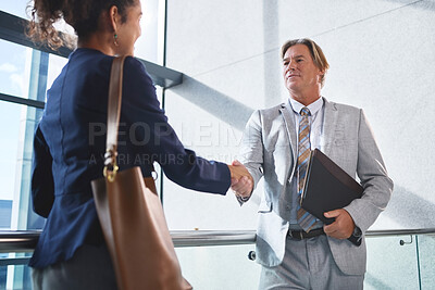 Buy stock photo Office, document and shaking hands of business people for meeting, representation and advocacy for immigration. File, female client and mature lawyer with handshake for hello, justice and welcome