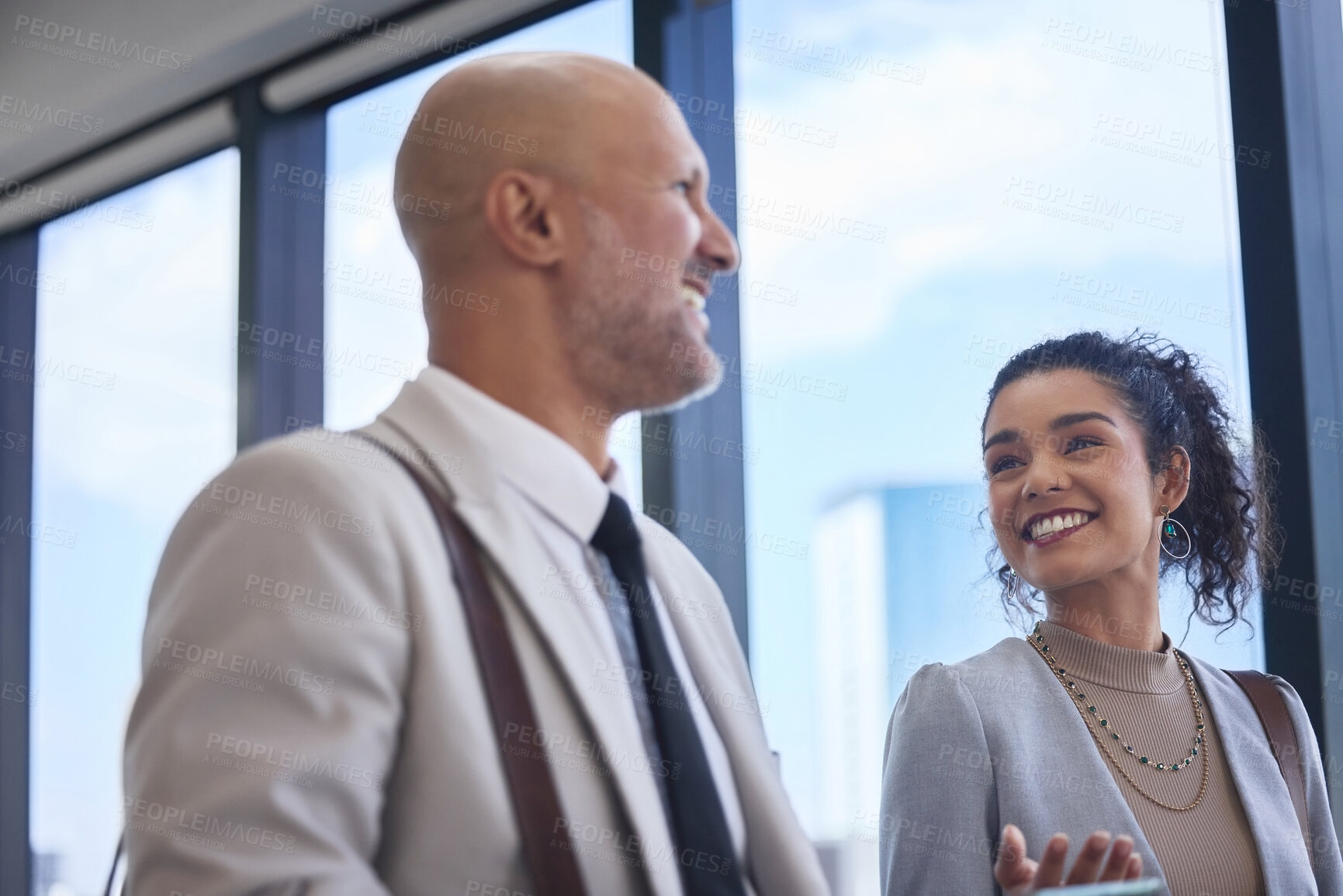 Buy stock photo Collaboration, smile and walking with business people in airport together for international travel. Conversation, corporate or teamwork with man and woman employee on bridge in terminal for flight