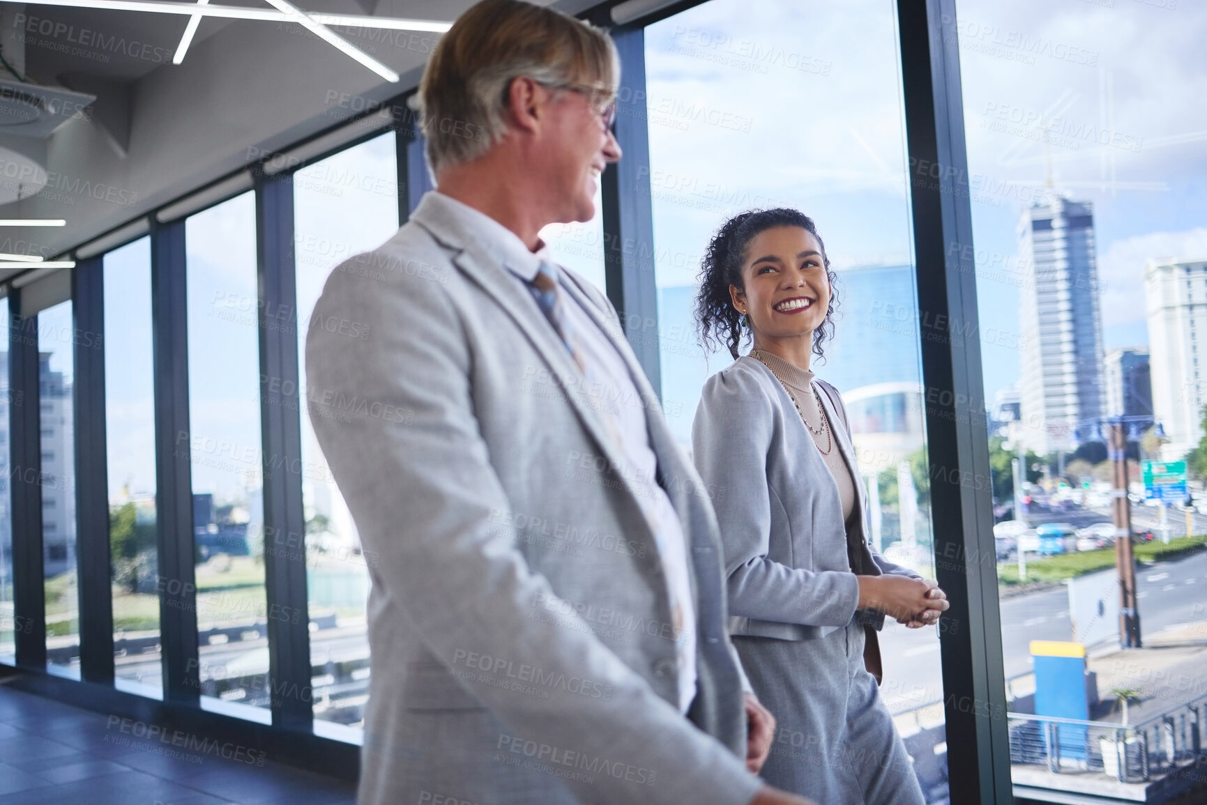 Buy stock photo Conversation, smile and walking with business people in airport together for international travel. Collaboration, corporate or teamwork with man and woman employee on bridge in terminal for flight
