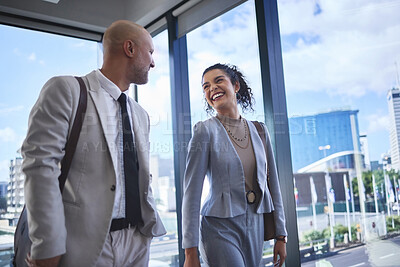Buy stock photo Collaboration, funny and walking with business people in airport together for international travel. Conversation, laughing or teamwork with man and woman employee on bridge in terminal for flight