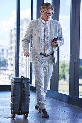 Buy stock photo Mature man, travel and phone in airport for communication, networking and check schedule or agenda. Director, corporate and mobile in building for investment, trading and booking of taxi or flight