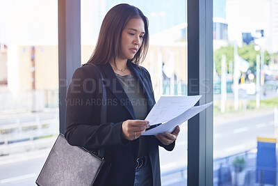 Buy stock photo Business, woman and reading paperwork in office for budget planning, finance portfolio and payment loan. Serious, female person and document for review, report and legal asset management of lawyer