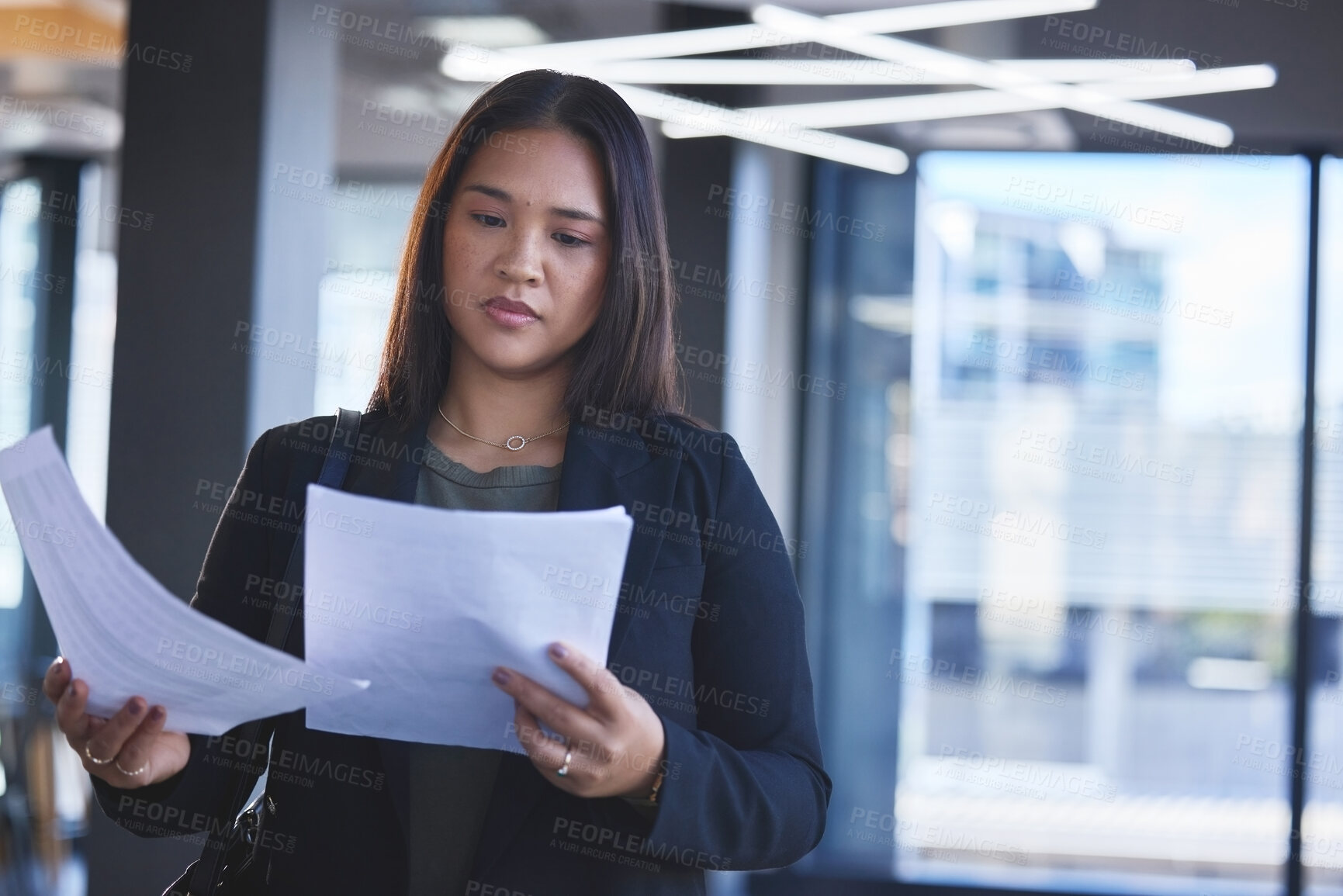 Buy stock photo Business woman, lawyer and reading paperwork with legal policy, report review and check contract agreement in office. Asian attorney, documents and analysis for testament, insurance and compliance