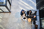 Business people, above and meeting in building with strategy, financial pitch with document for collaboration. High angle, tax accountant and table teamwork with budget paper for economy in office