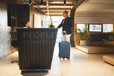 Buy stock photo Service, reception and mature man with luggage in hotel for business meeting, hospitality or check in. Travel, concierge woman and person with suitcase for welcome, vacation or sales convention