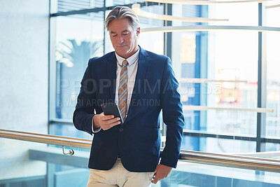Buy stock photo Phone, communication and businessman in office for email for corporate networking with client. Cellphone, reading and mature male finance executive with online company revenue report in workplace.