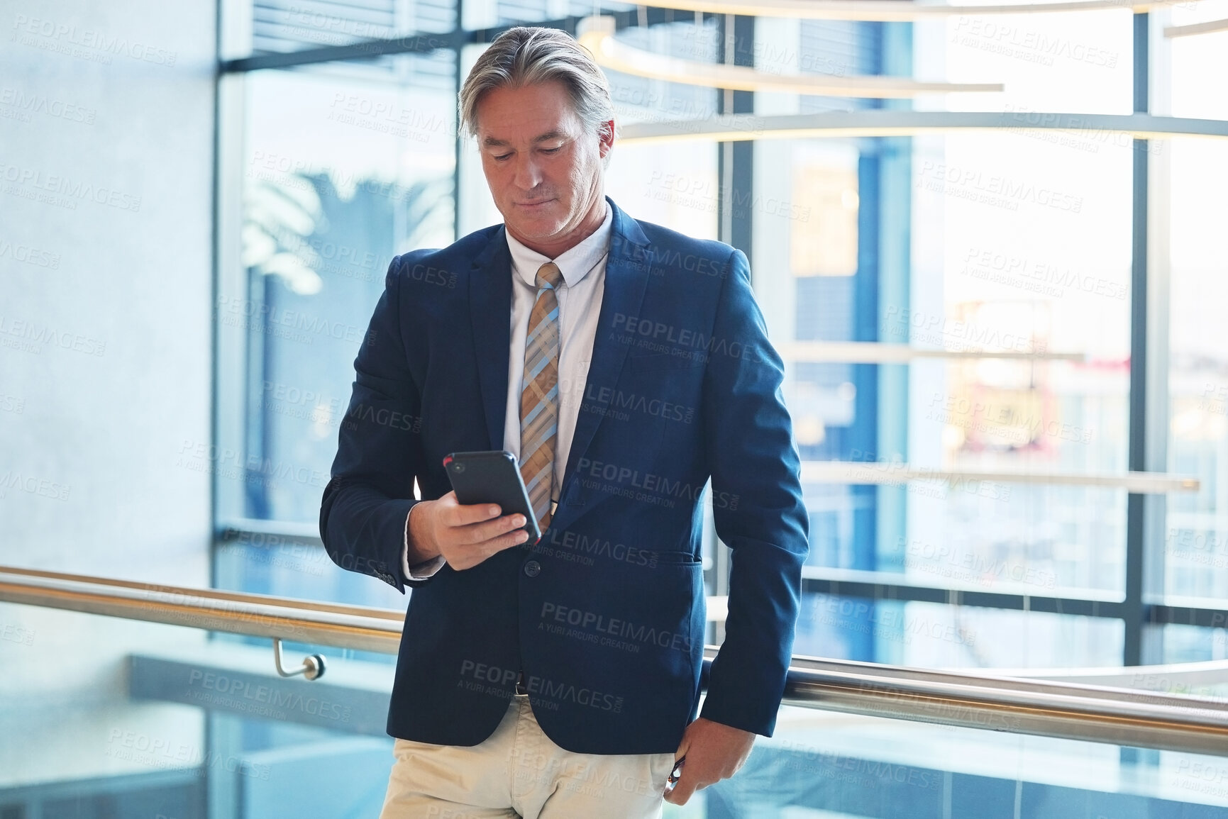 Buy stock photo Phone, communication and businessman in office for email for corporate networking with client. Cellphone, reading and mature male finance executive with online company revenue report in workplace.