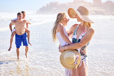Buy stock photo Holiday, children and parents on beach with smile, fun and bonding together on outdoor travel adventure. Mom, dad and kids on summer island vacation with ocean waves, happy family support or laughing