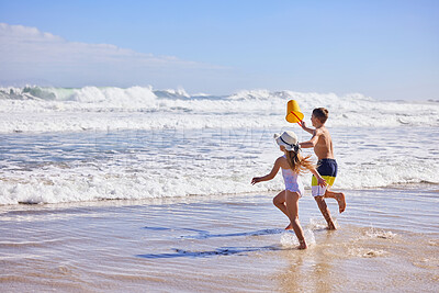 Buy stock photo Kids, water and running with bucket at beach for playing with fun activity, summer holiday or race game. Children, freedom and bonding on sand with tropical adventure, family vacation or plastic toys
