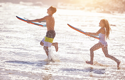Buy stock photo Surfboard, happy and children at beach in waves for summer vacation, holiday and weekend on tropical island. Relax, family and kids in water, ocean and sea for bonding, relationship and fun together