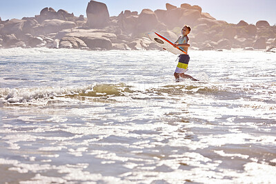 Buy stock photo Surfing, happy and child at beach in waves for summer vacation, holiday and weekend with surfboard. Relax, travel and kid in water, ocean and sea for playing, having fun and water sports outdoors